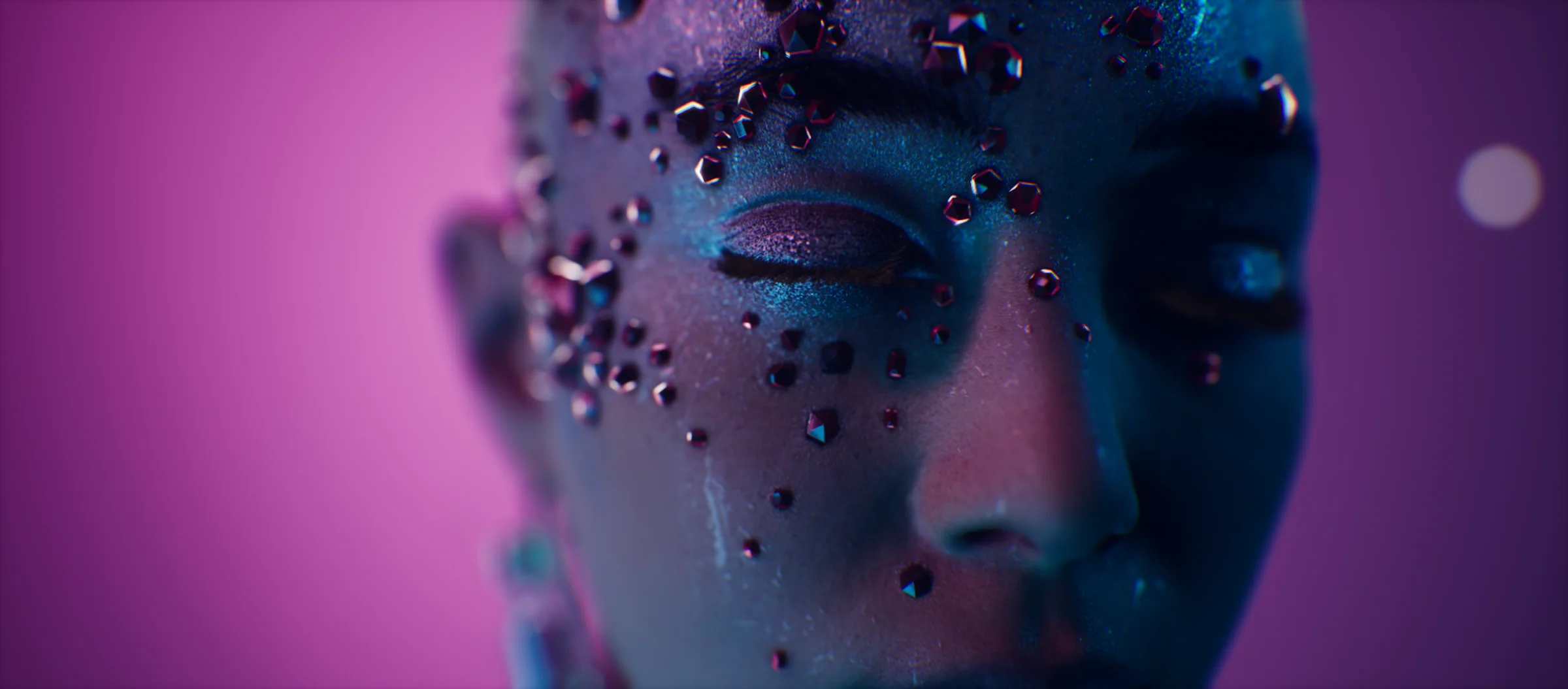 A face set with dark crystals, lit in magenta and blue